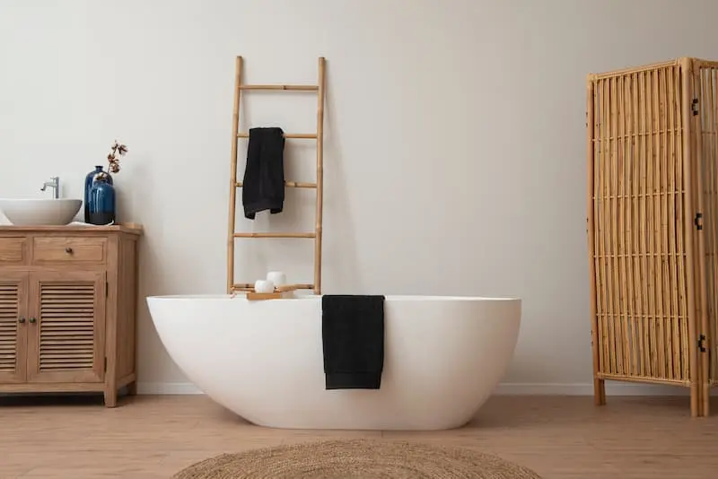 egg-shaped vessel tub with rattan accents